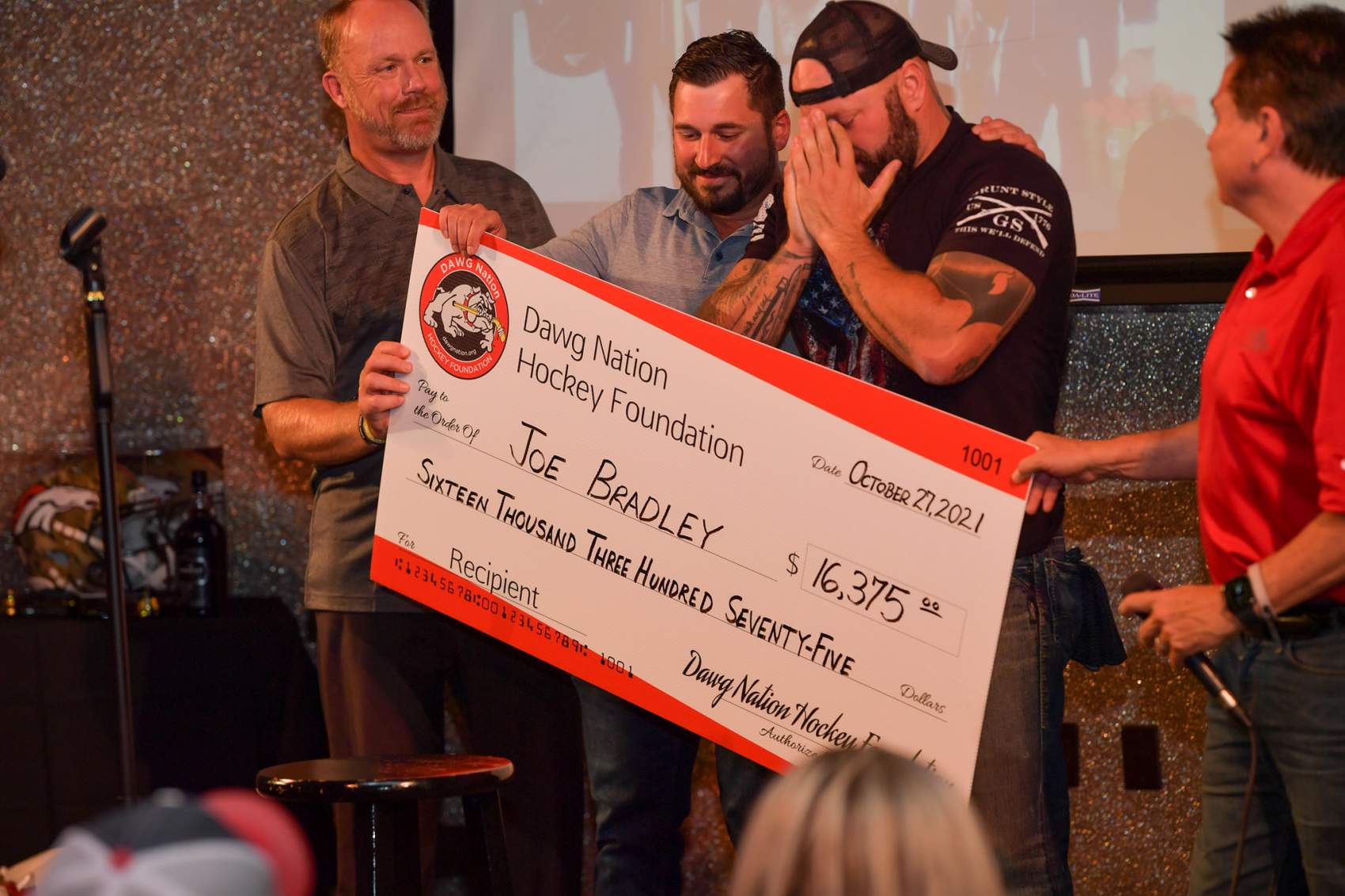 Joe Bradley receiving check.