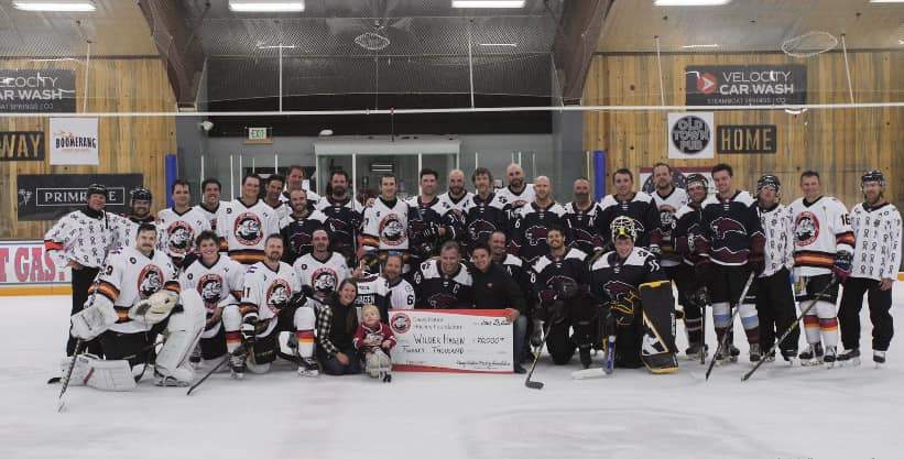 steamboat hockey team with check