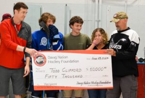 todd clifford receiving check