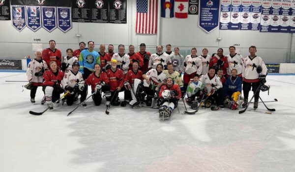 hockey team at center ice posing for picture