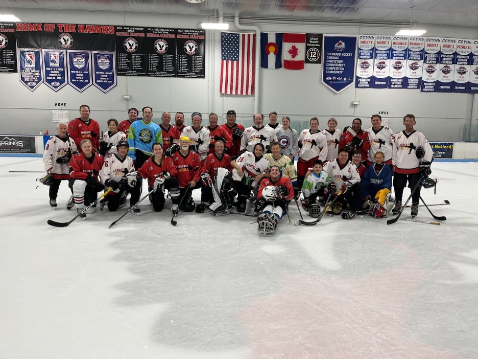 hockey team at center ice posing for picture