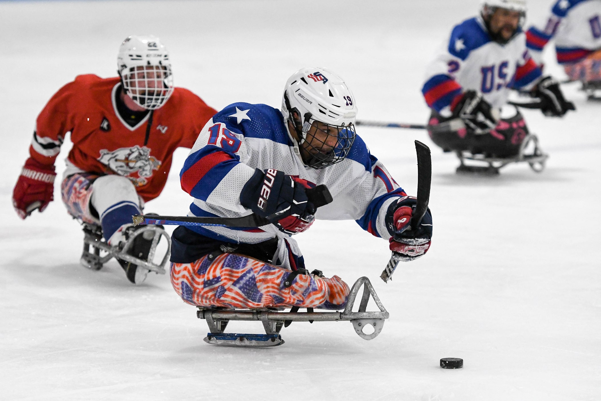 two sled hockey players